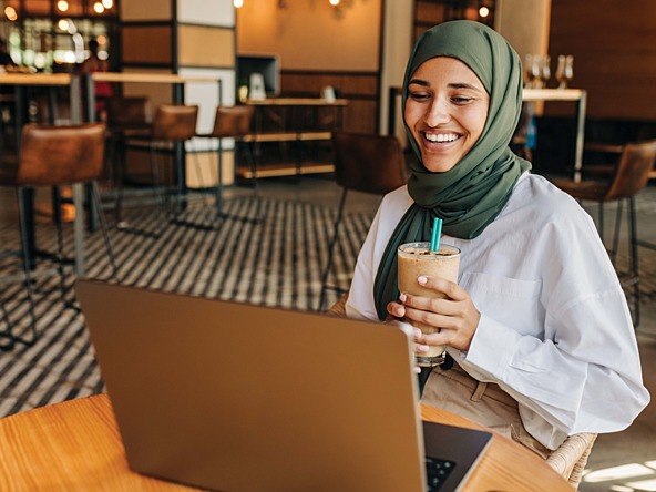 a woman on her laptop in a costa coffee cafe